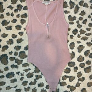 Pink zip up body suit
